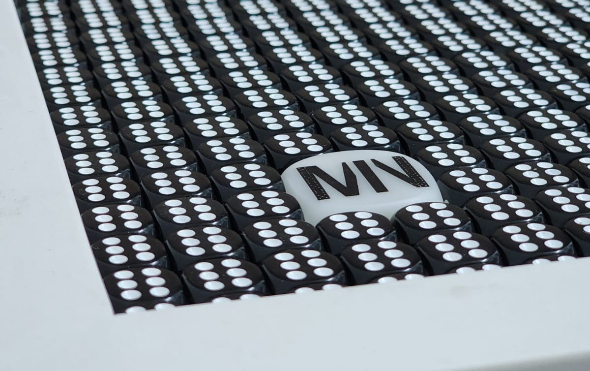 Close up loop of a Marmo Nero dice composition